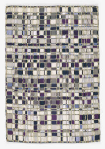 A plaid weaving made from purple, periwinkle and gray squares