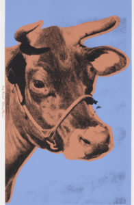 Image features Andy Warhol's iconic Cow wallpaper with a large salmon-colored cow head on a blue background. Please scroll down to read the blog post about this object.