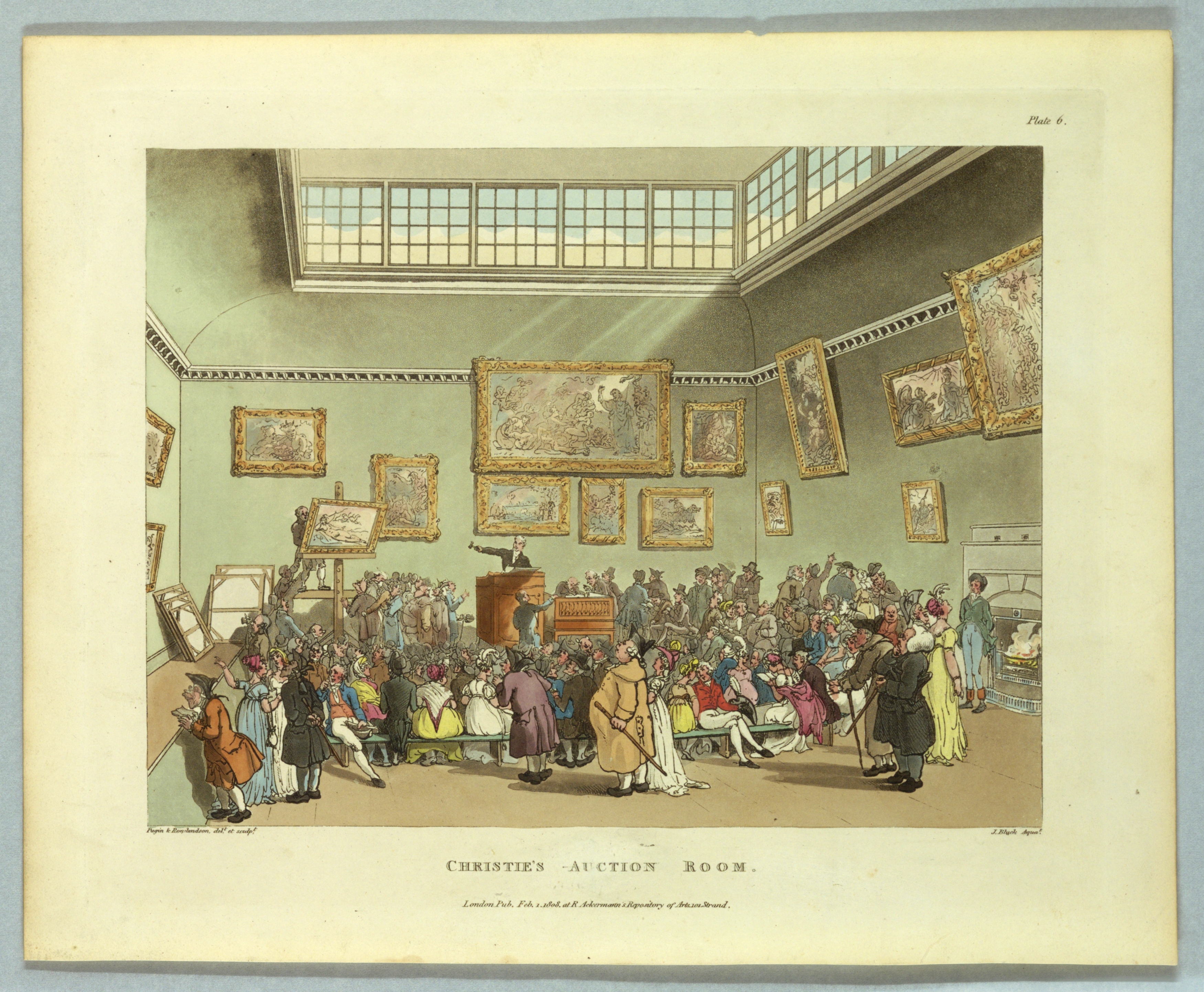 An interior scene showing Christie's Auction Room in the year 1808 from the print series 'Microcosm of London.' A crowd stands in a high-ceilinged room, with cool green walls and light streaming in through high windows. Paintings in ornate and gilded frames are hung salon-style, seemingly jumbled, with vaguely recognizable classical compositions: here an Annunciation, there an Adoration, a saint, or an equestrian scene, a portrait. A framed reclining Venus (nude woman) is displayed on the auction stand, next to an auctioneer who gestures with his gavel. A lively and colorful crowd fills the room, with detailed dress and caricatured features.