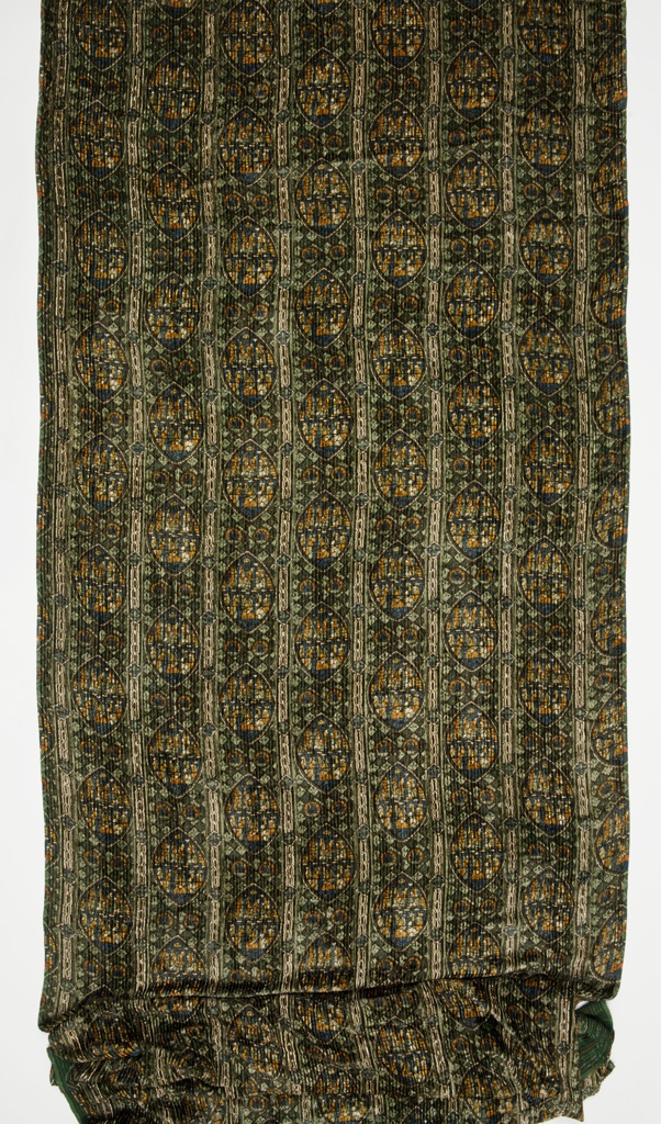 Image features a length of velvet with wales, having a repeating pattern of pointed oval stained glass windows set between vertical bands decorated with diamond shapes. Please scroll down to read the blog post about this object.