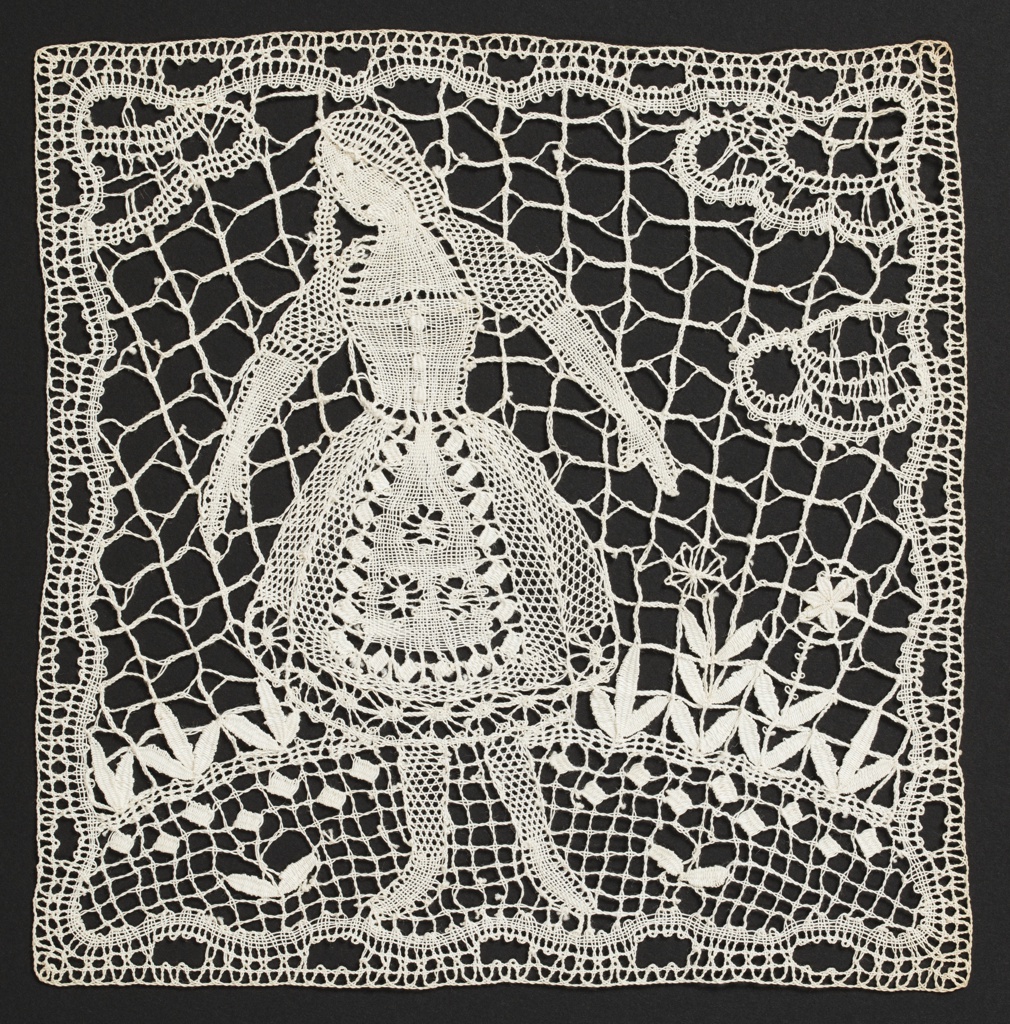 Image features: Two round doilies: one with a fanciful bird, the other with a stylized palm tree. Square lace inserts for a curtain contain a female figure in traditional dress, the other has a male figure with outstretched arms and an owl. Please scroll down to read the blog post about this object.