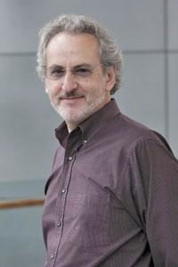 Photograph of Donald Ingber, one of the panelists. Don has light gray hair and short beard. He has glasses and smiles at the camera. 