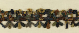 Image feature a colorful wool border depicting birds and flowers. Please scroll down to read the blog post about this object.