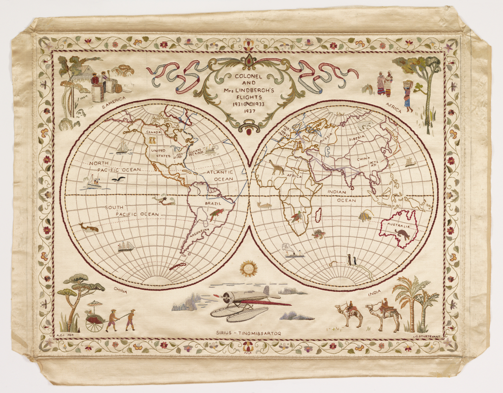 Image features a map sampler showing the globe in two hemispheres, tracing the flights of Colonel and Mrs. Lindbergh in 1931, 1933, and 1937. There are scenes in each corner labeled S. America, Africa, China, and India. At the bottom center, there is a plane labeled the Sirius-Tingmissartoq. The map is surrounded by a scrolling floral border. Please scroll down to read the blog post about this object..