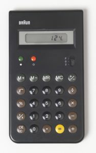 Flat, black, upright rectangular form, the "BRAUN" logo in white letters at top left, above rectangular window for numercial read-out; below window, at left, two small slightly domed buttons: green "on" and red "off," with decimal place switch at right, all above five rows of slighly domed black, brown, and yellow function and number keys.