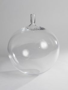 Image features a globular, clear colorless glass vase with a short, narrow cylindrical neck. Please scroll down to read the blog post about this object.