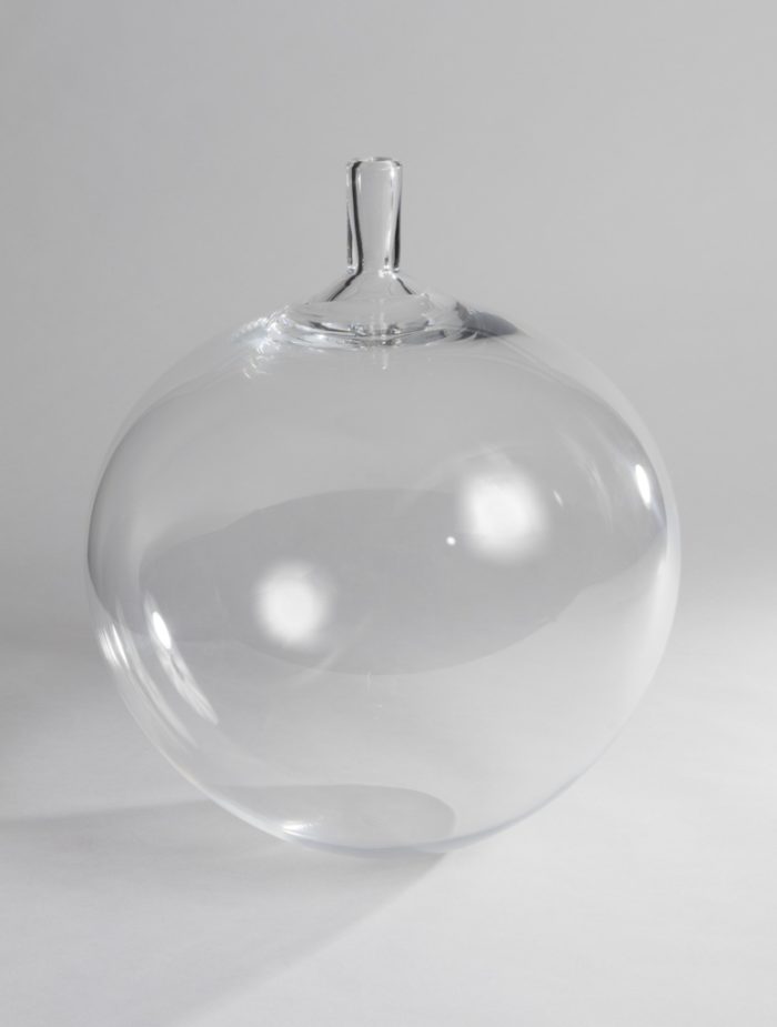 Image features a globular, clear colorless glass vase with a short, narrow cylindrical neck. Please scroll down to read the blog post about this object.