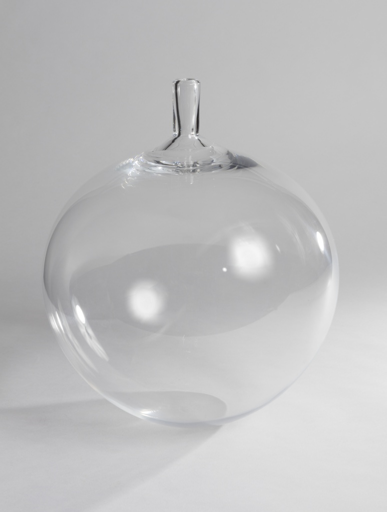 Image features a globular, clear colorless glass vase with a short, narrow cylindrical neck. Please scroll down to read the blog post about this object.