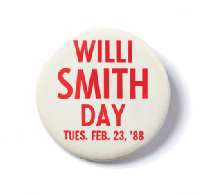 A pin with the red words on a white background, saying Willi Smith Day Tues. Feb 23, '88