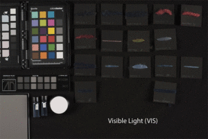 GIF showing reference samples of wool with indigo and other dyes used in combination, imaged with different techniques, which change colors in the animation.