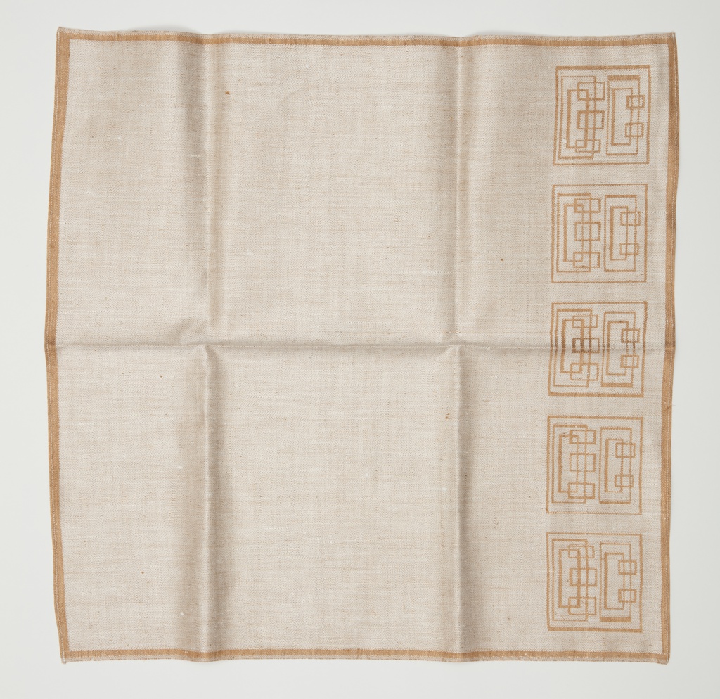 Image features a linen damask napkin with a geometric design of interlocking squares along one edge, in light tawny brown. Please scroll down to read the blog post about this object.