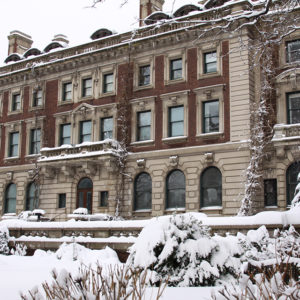 View of the south-facing edifice of Carnegie Mansion covered in snow.