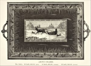 This image features Reed & Barto silver serving tray with arctic scenery- icicles, icebergs, man on sled pulled by a reindeer.