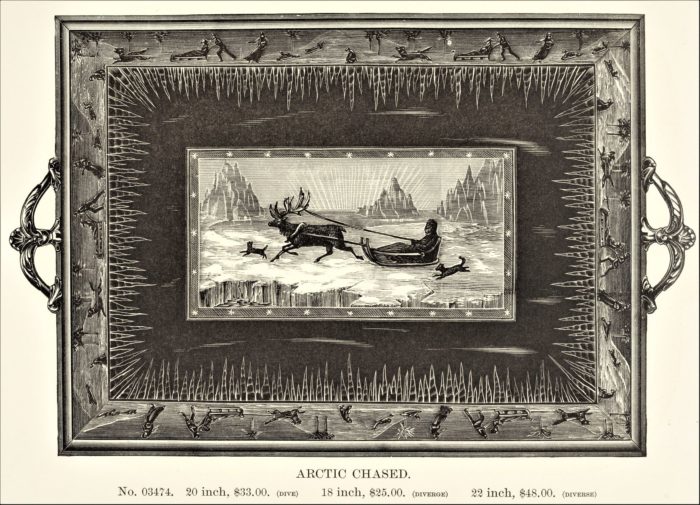 This image features Reed & Barto silver serving tray with arctic scenery- icicles, icebergs, man on sled pulled by a reindeer.