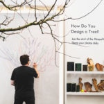 Designer Sam Van Aken draws a colorful diagram of his Tree of 40 Fruit on a wall behind the actual Tree of 40 Fruit