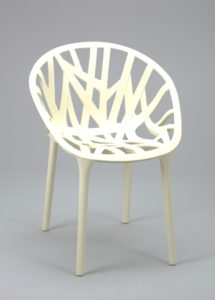 Image features a white plastic chair molded in the form of a circular basket-type seat of flat branch-like elements on four thin cylindrical legs. Please scroll down to read the blog post about this object.