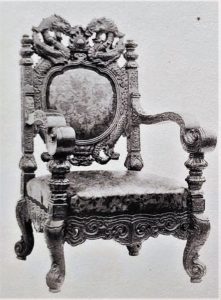 This image features item No. 60. The “Kwagenkei” Arm-chair. Carved in mulberry wood and upholstered with “Kinkara Kawa” leather. The ornamentation was originally used for a stone gong musical instrument in the temple of Horyuji.
