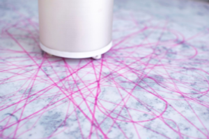 Lines drawn by the cochineal machine form an asterisk-shaped design
