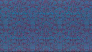 An ornate sunflower pattern printed in teal on a magenta background creates an eye-boggling effect