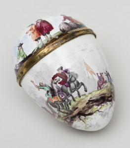 An egg-shaped vessel on which are painted historic figures. In one small painting, a man on horseback with a large black moustache and green shirt throws an arm into the air as another man in horseback appears to reach toward him. In another painting two men in historic garb, including tunics and brimmed hats, look on as another man rolls a barrel.