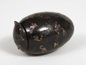 Egg-shaped box with hinged lid; tortoiseshell with all-over decoration of scrolls, flower sprays, birds, and butterflies piqué, point, and posé in gold.