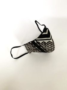 A fabric mask made with the black and white inSALAAM inSHALOM fabric
