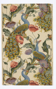 On machine printed paper, a repeated motif of two azul and golden peacocks surounded by purple and pink poppies connected with vines on an off-white background.