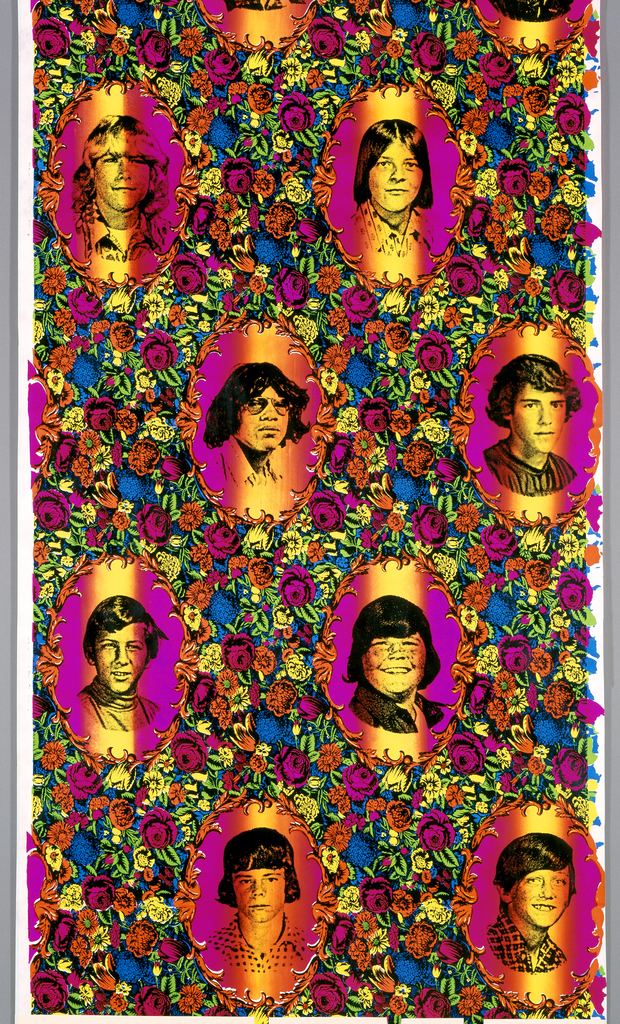 Image features a wallpaper panel showing yearbook portraits of teenage boys displayed in decorative oval frames surrounded by flowers on a bright rainbow-colored ground printed in fluorescent ink and black rayon flock. Please scroll down to read the blog post about this object.