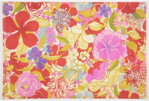 Drawn, watercolor textile design made up of several varieties of flowers in crimson, pale fuchsia pink, sky-blue, white and violet, with gold and forest-green leaves against a white background.
