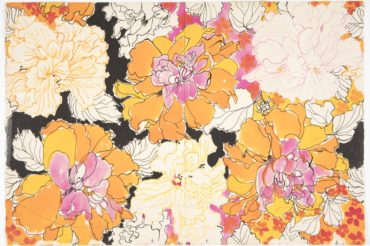 Watercolor textile design with full yellow-orange and pink blossoms outlined in black, alternating with cream flowers outlined in the same colors. Black-outlined leaves, colorful small florals, and black patches fill in the design.