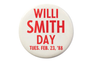 A white pin with red lettering on a white background. The pin reads: "Willi Smith Day Tues, Feb 23, '88"