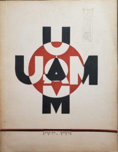 Image features the cream-colored cover of the 1929 UAM catalog, showing the capital letters UAM in black and cream-white, aligned vertically and horizontally and superimposed on a large red circle. Please scroll down to read the blog post about this object.