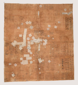 Image features: Large wrapping cloth made from sheets of paper from account ledgers, glued together and stained with persimmon, giving a brownish color except where later patched with lighter colored papers. Writing still evident on sheets. Please scroll down to read the blog post about this object