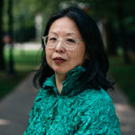 Portrait of Yao-Fen You in a park wearing a textured green shirt