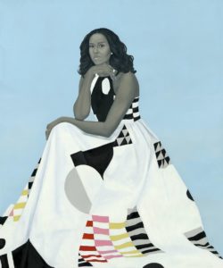 Portrait of former First Lady Michelle Obama seated looking directly at us