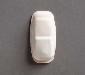 White oblong sensor in soft, rubbery material