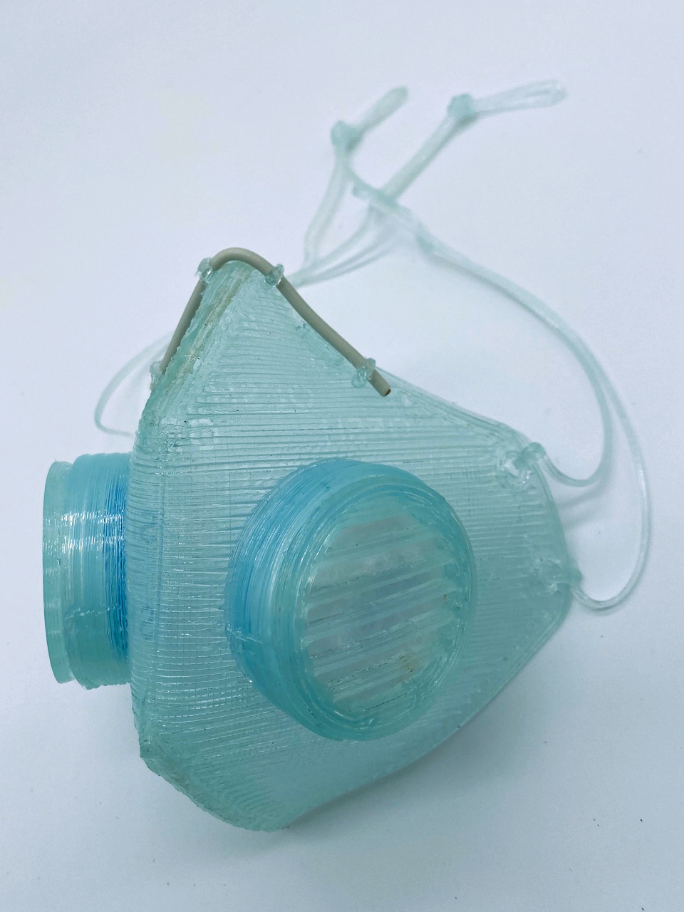 Light blue translucent respirator with two disk-like protrusions