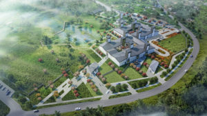 Rendering, aerial view of hospital plan site showing meandering geometric building with many raised chimneys