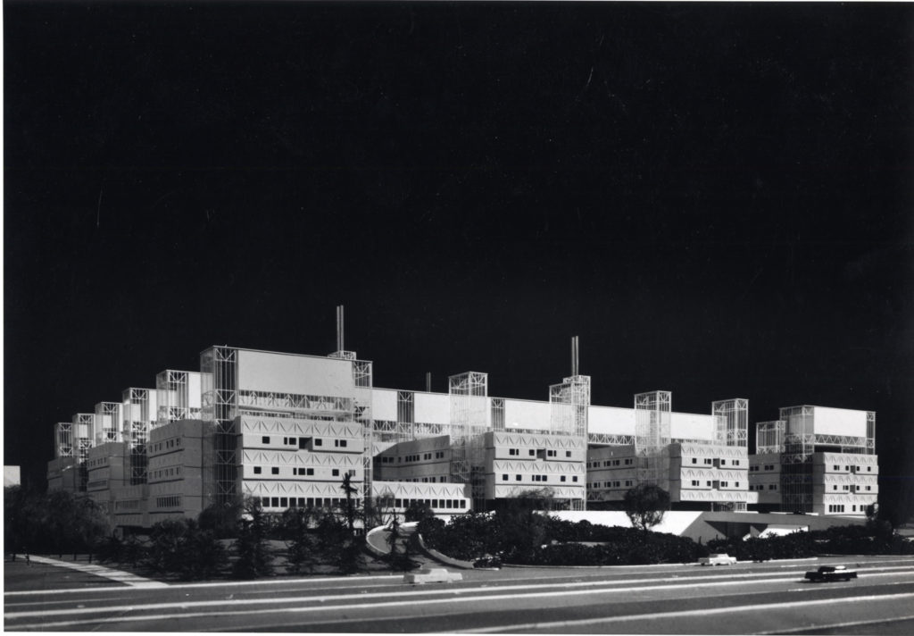 Black and white external photo of the industrial style McMaster University Health Sciences Center.