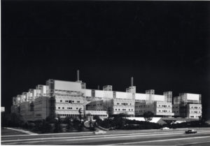 Black and white external photo of the industrial style McMaster University Health Sciences Center.