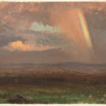 A mid-toned landscape with billowing pink-tinged grey clouds and a stripe of vibrant rainbow cascading from the top right above deep green and earth brown plains and blue-grey mountains.