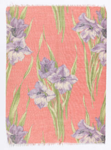 Silk printed textile with purple amaryllises and green leaves, on pink background