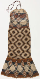 Long halter dress with intricate geometric checkered pattern in beige, shades of brown, and black