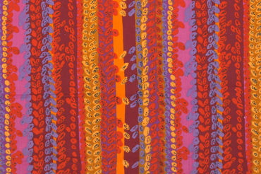 Vertical columns of vibrant reds, oranges, pinks, and purples cover a long, horizontal textile, with equally vibrant columns of leaf-like ovals overlaid on most of the fabric.