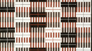 Alternating rectangular sections of red and black lines that have the appearance of piano keys cover a bright white background; the repeating lines and high contrast between the colors has a dizzying effect.