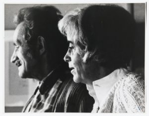 Black and white photo of an older man and woman in profile, looking off to the left.