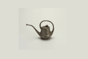 Animated gif showing a photo of a stylized metal teapot being positioned and repositioned inside an abstracted analog clock face to align the center and minute hand with the spout.