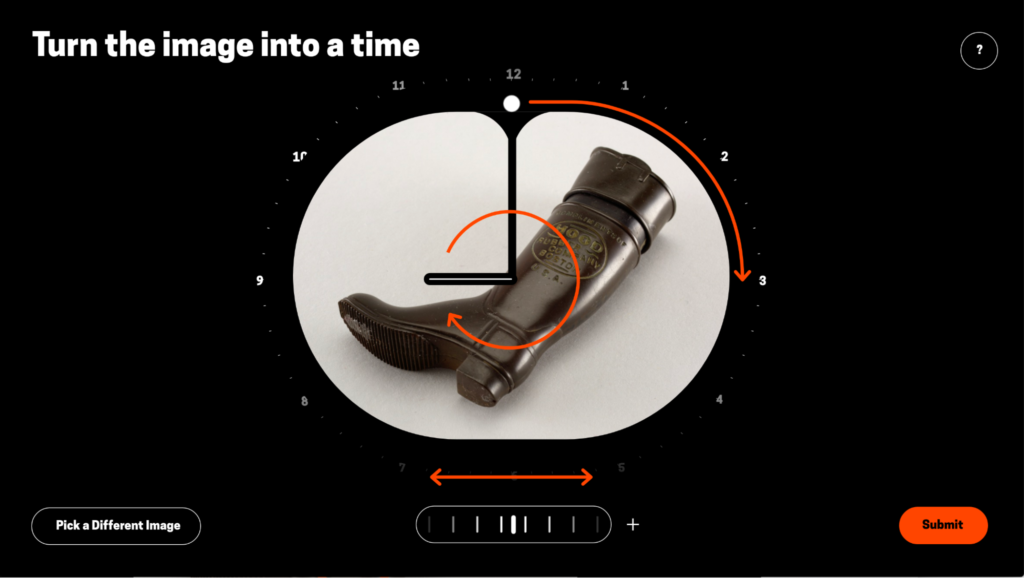 This image shows the process of turning a single image into a time. At the center is an oval shaped photo of a brown boot lying on its side surrounded by a black background. Superimposed on top of the boot are clock hands and orange arrows meant to indicate how the user can manipulate the image to identify the time that the image's angles correspond to. On the upper left hand side, text reads 
