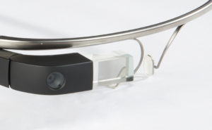 Close-up shot of the glass prism and camera on the rim of a beta version of Google Glass.