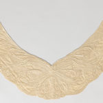 Very delicate cream-colored silk collar, embroidered with sweeping lines.